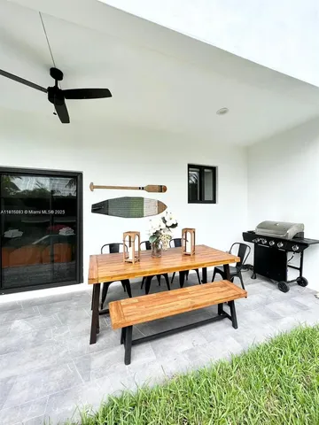 a bedroom with furniture and a rug