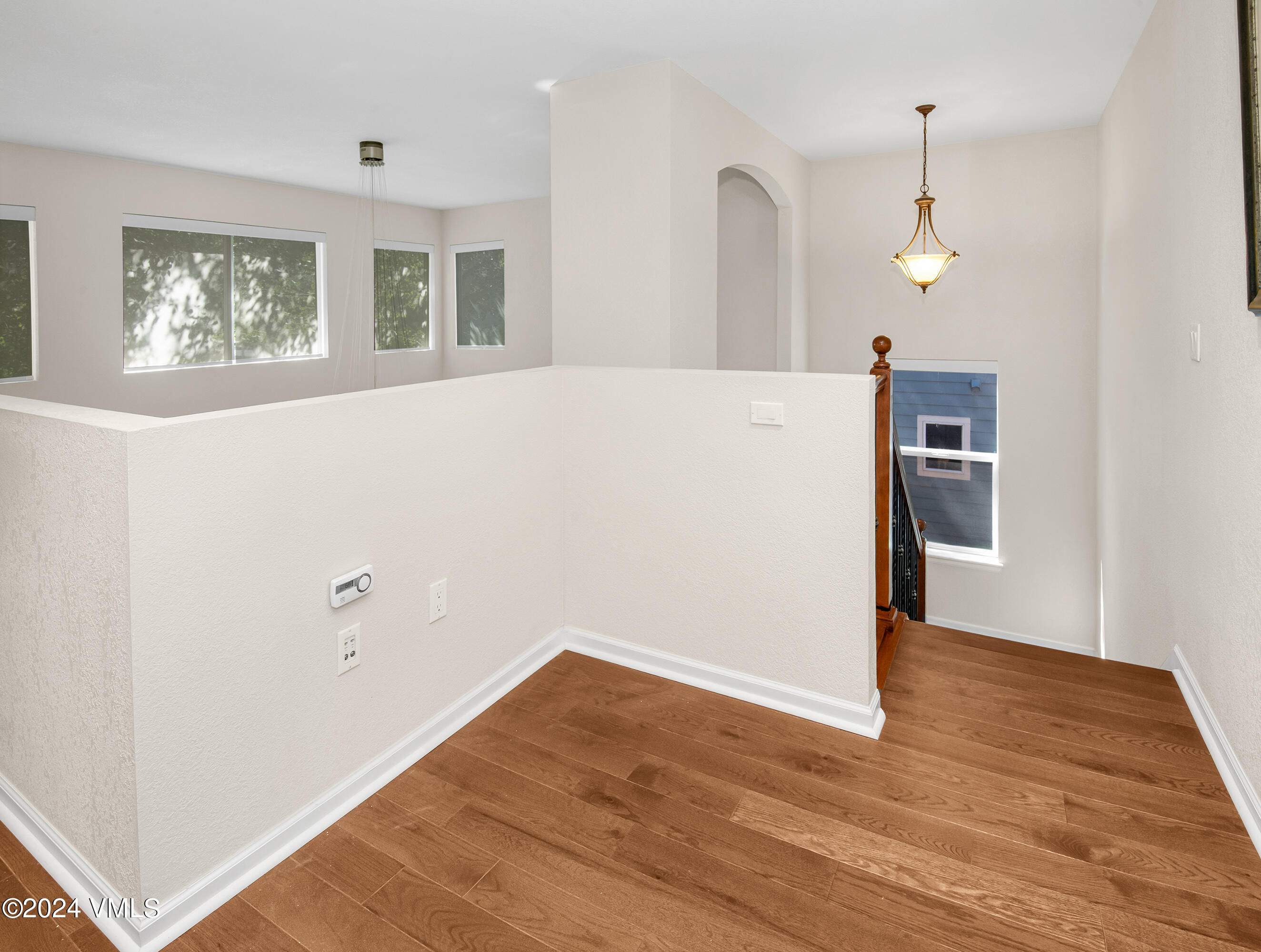 216 Mayer Street Eagle, CO 81631 - Photo 19 of 51 a view of a kitchen with wooden floor and a ceiling fan