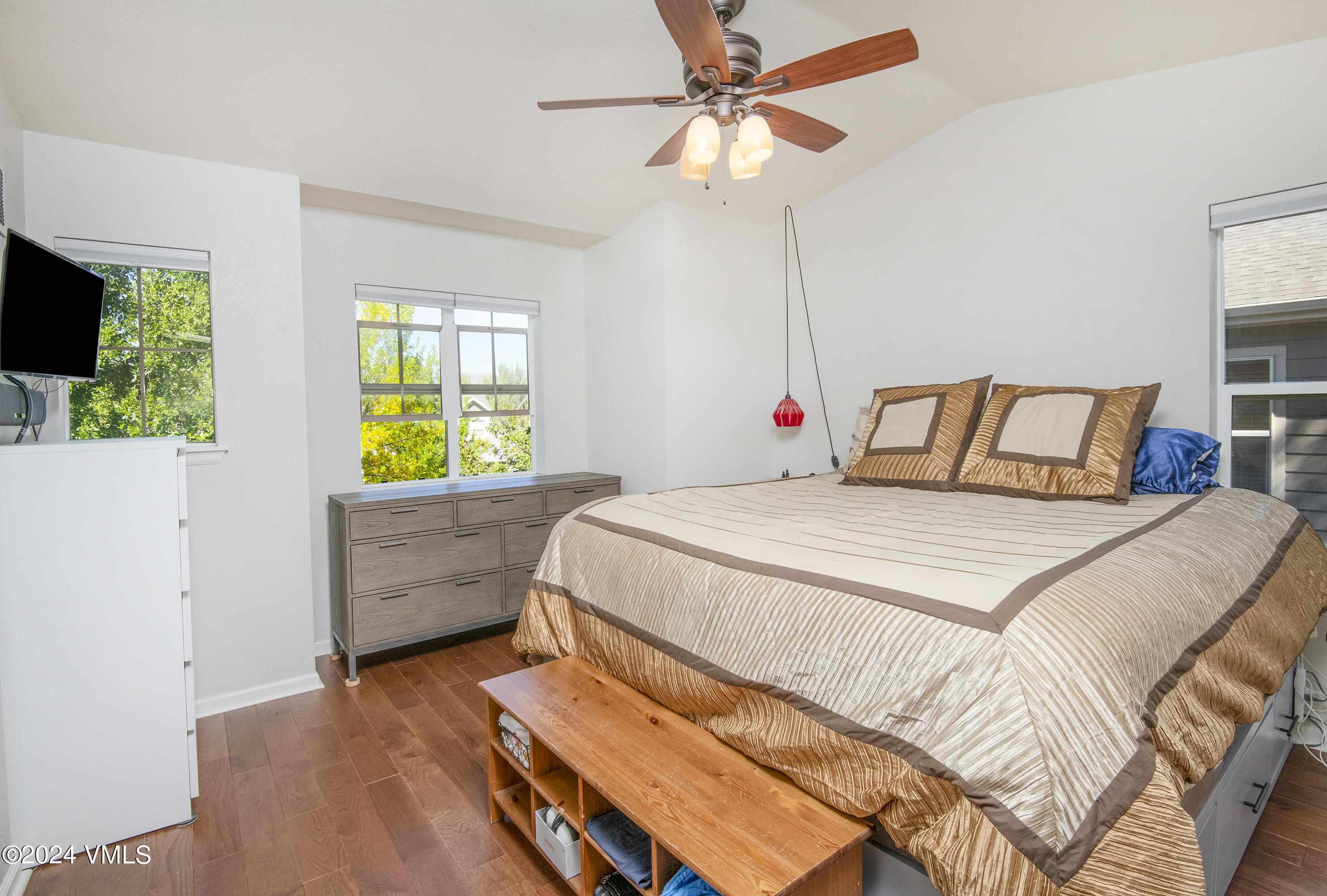 216 Mayer Street Eagle, CO 81631 - Photo 23 of 51 a bedroom with a bed and a chandelier