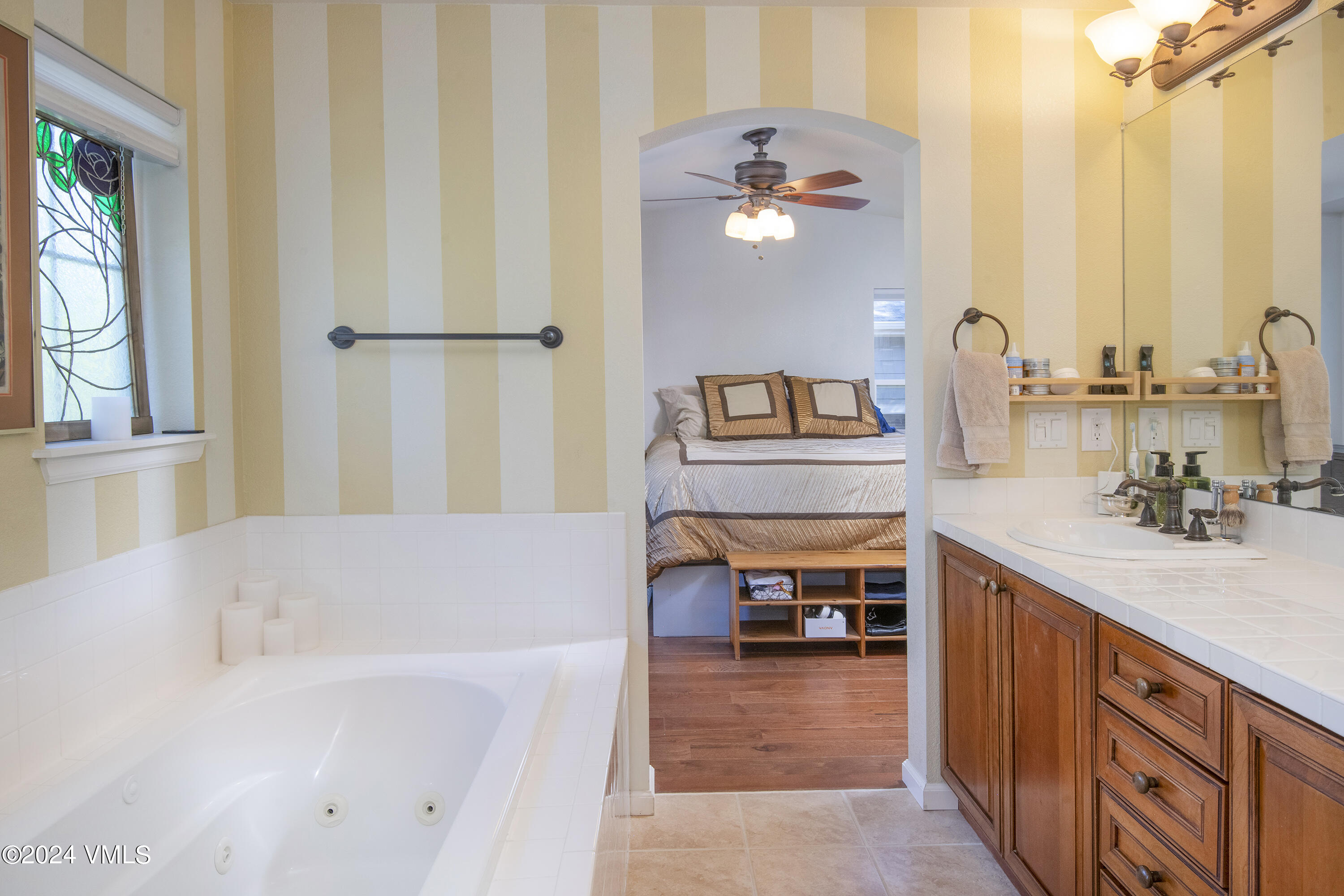 216 Mayer Street Eagle, CO 81631 - Photo 24 of 51 a bathroom with a tub sink and mirror