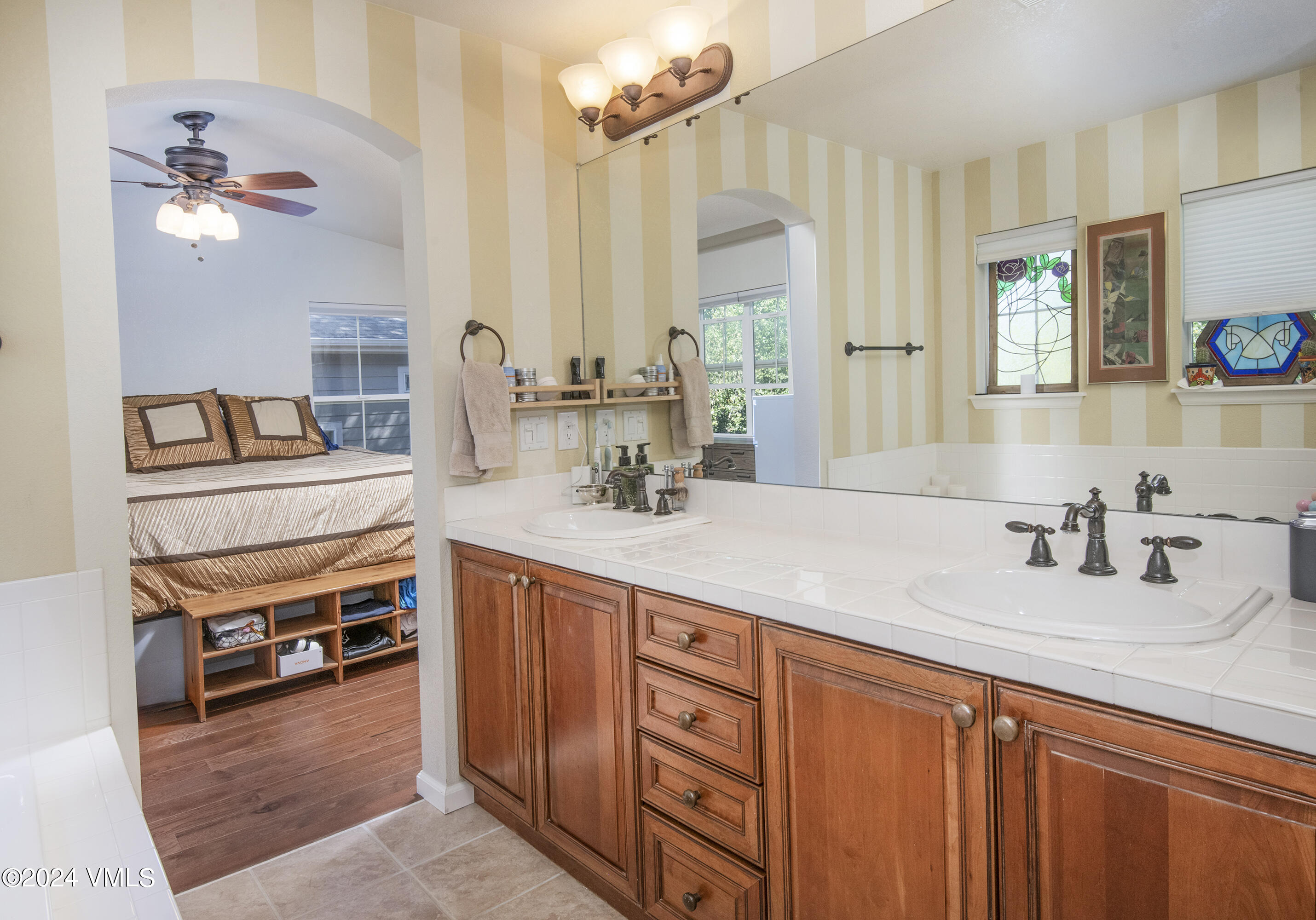 216 Mayer Street Eagle, CO 81631 - Photo 25 of 51 a bathroom with a sink double vanity and a mirror