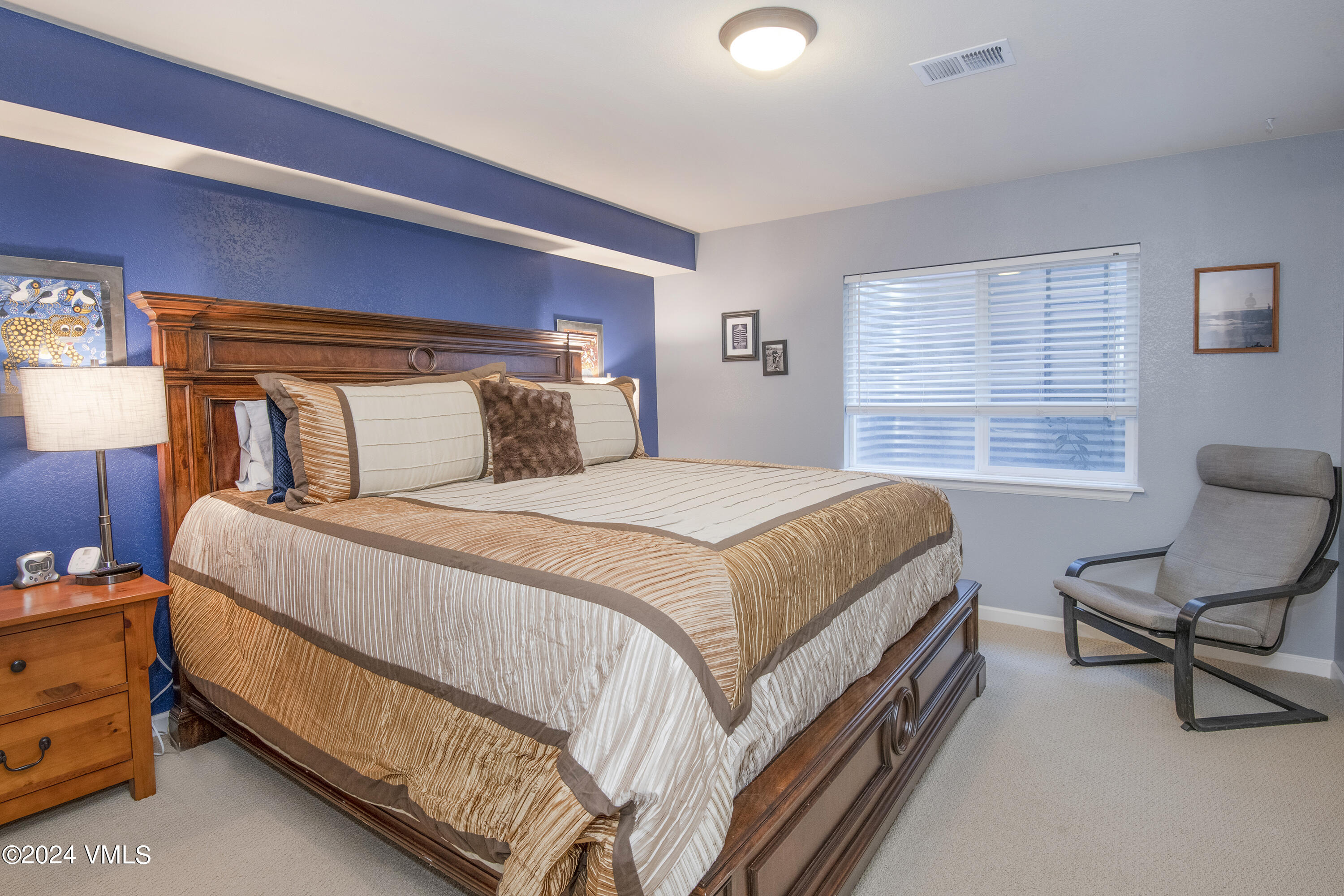 216 Mayer Street Eagle, CO 81631 - Photo 34 of 51 a bedroom with a bed chair and window