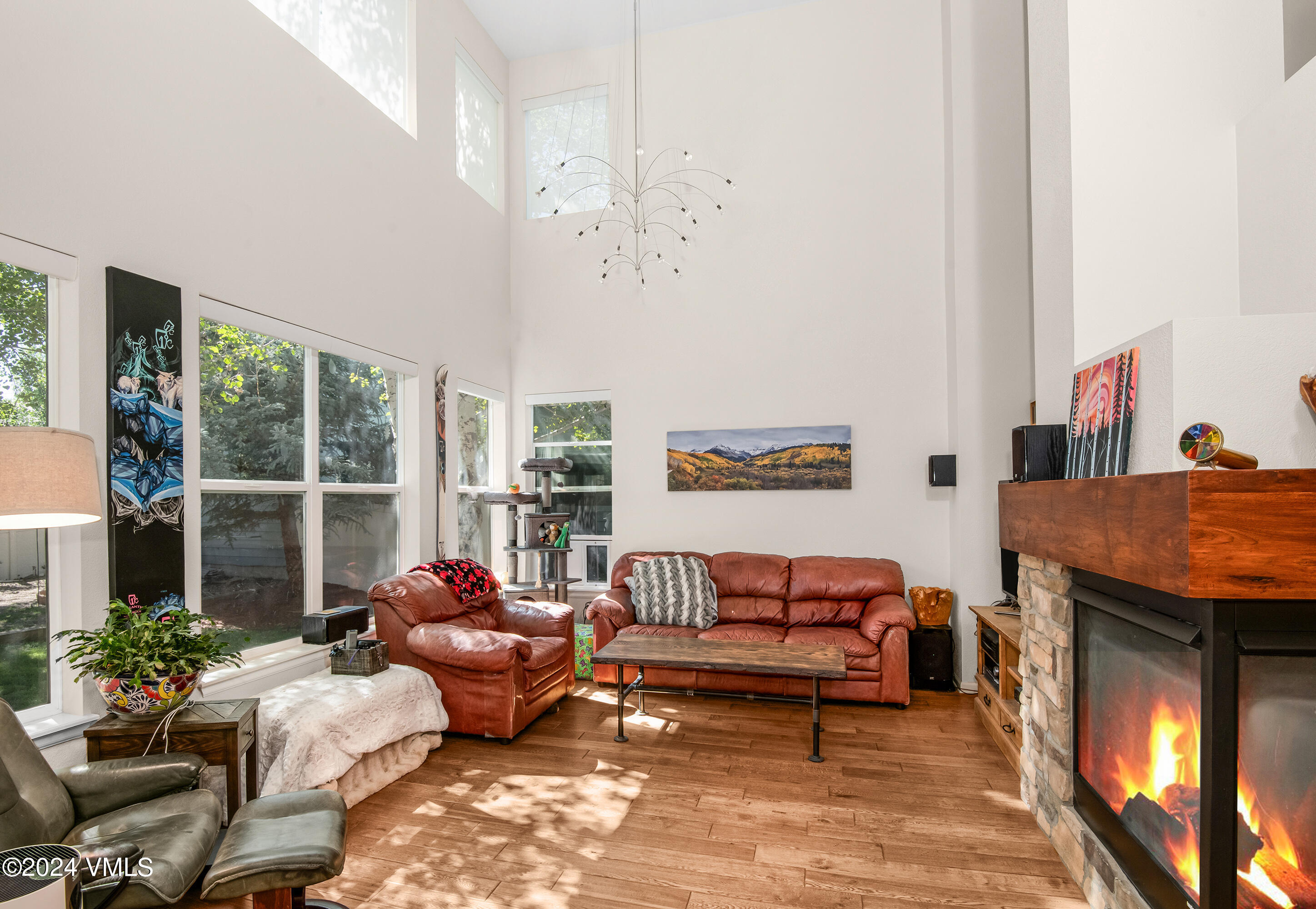 216 Mayer Street Eagle, CO 81631 - Photo 3 of 51 a living room with furniture a window and a fireplace