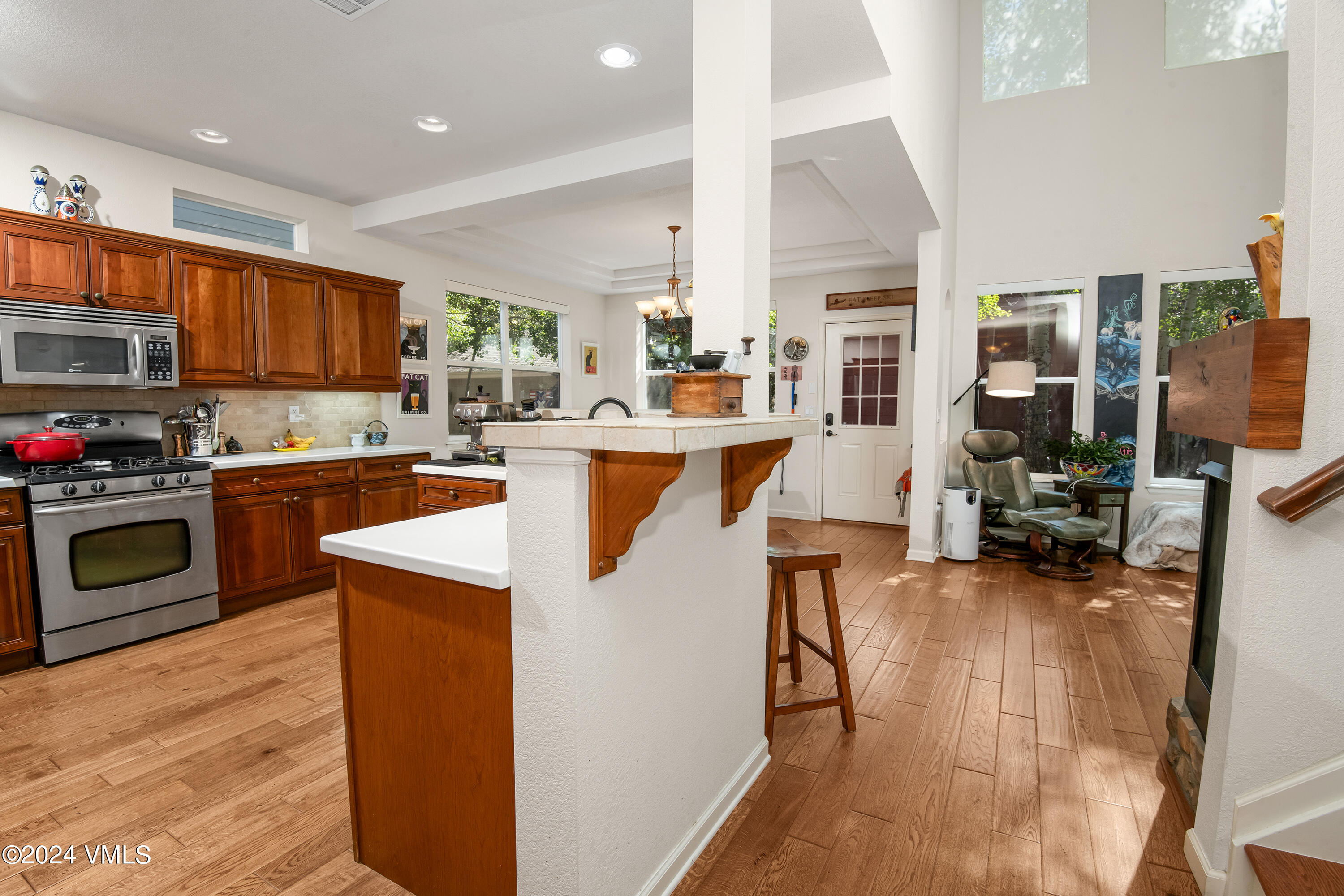 216 Mayer Street Eagle, CO 81631 - Photo 5 of 51 a kitchen with stainless steel appliances granite countertop wooden floors and sink