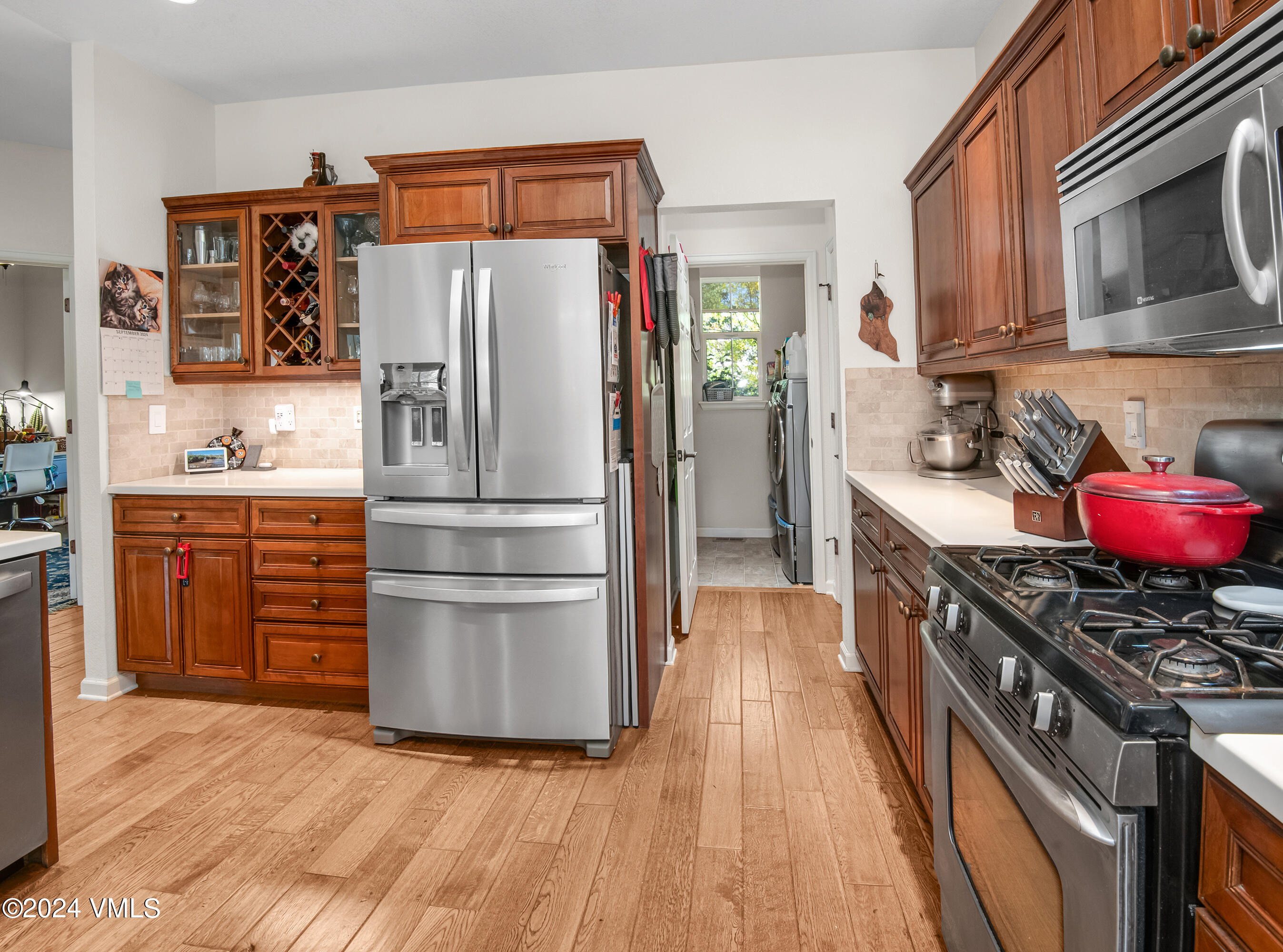 216 Mayer Street Eagle, CO 81631 - Photo 6 of 51 a kitchen with stainless steel appliances a refrigerator stove and sink