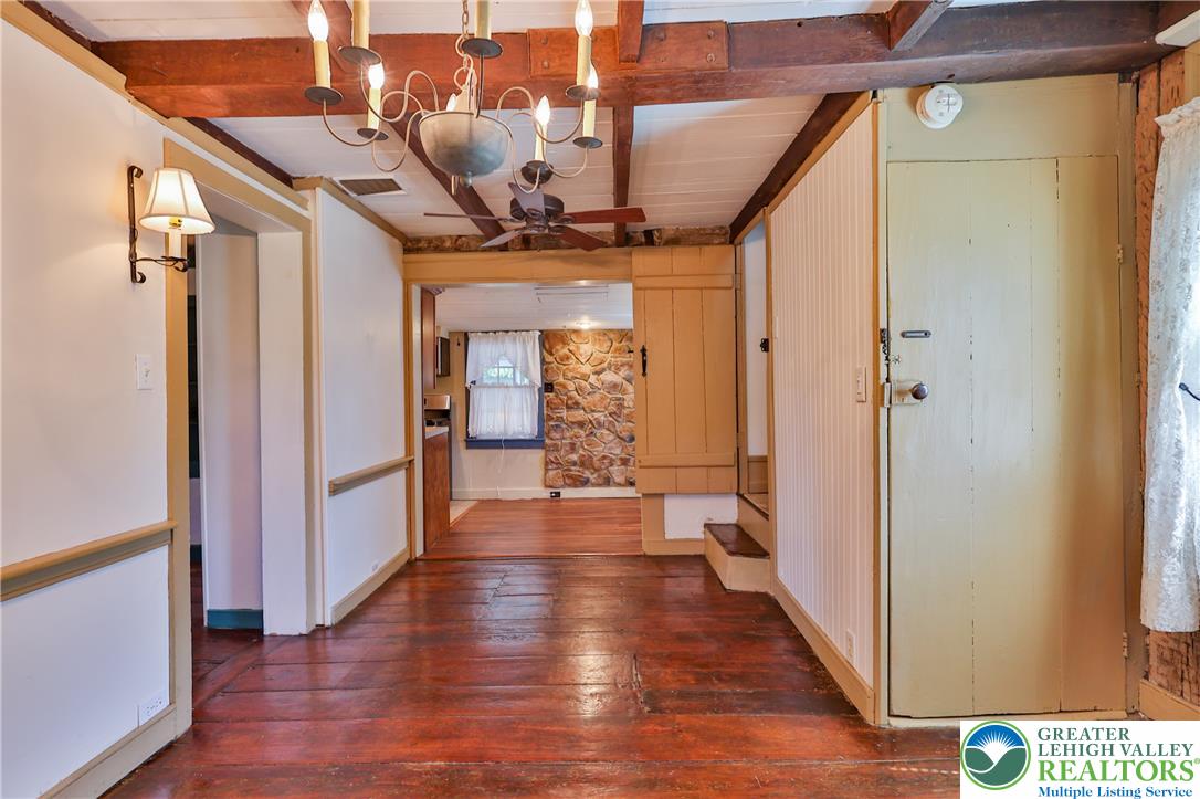 666 Point Phillips Road Bath, PA 18014 - Photo 30 of 68 Exposed wood beams and rich wood flooring create a rustic and inviting atmosphere.