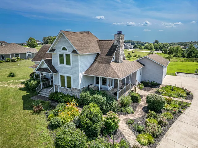 an aerial view of a house with a garden
