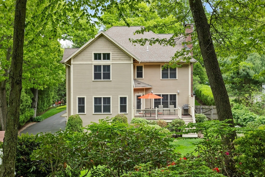 5 Walnut Street Lexington, MA 02421 - Photo 26 of 34 a house view with a garden space