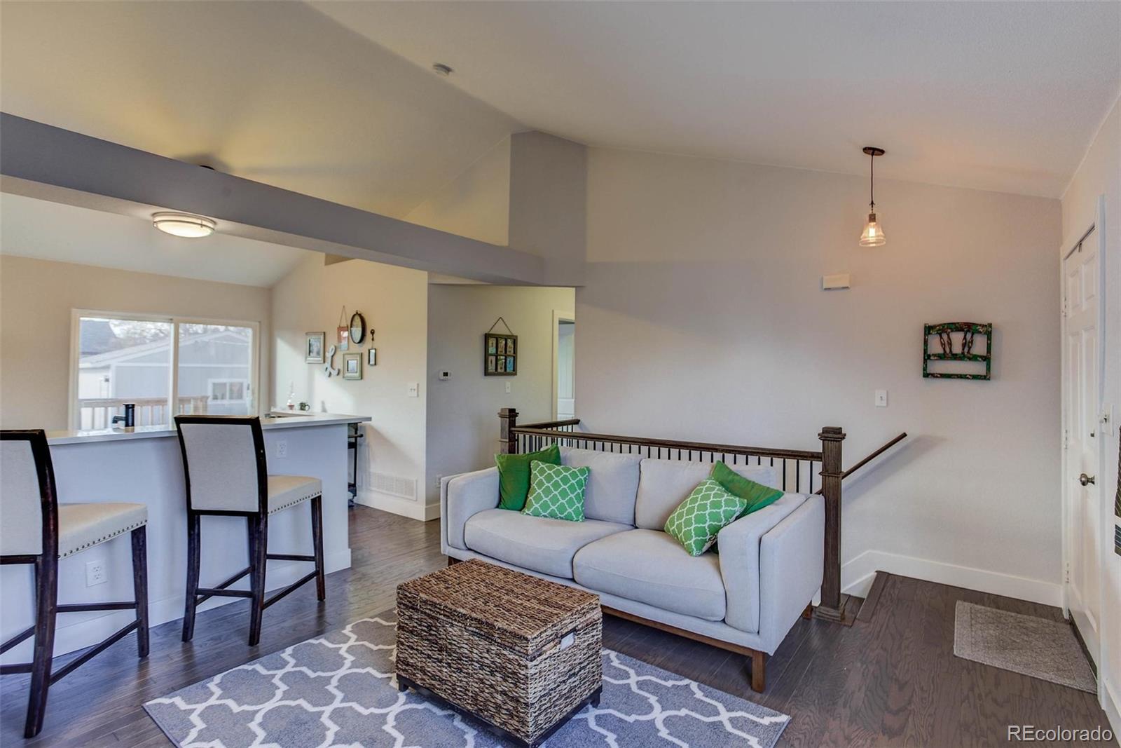 2939 Benton Street Wheat Ridge, CO 80214 - Photo 6 of 29 a living room with furniture and a wooden floor