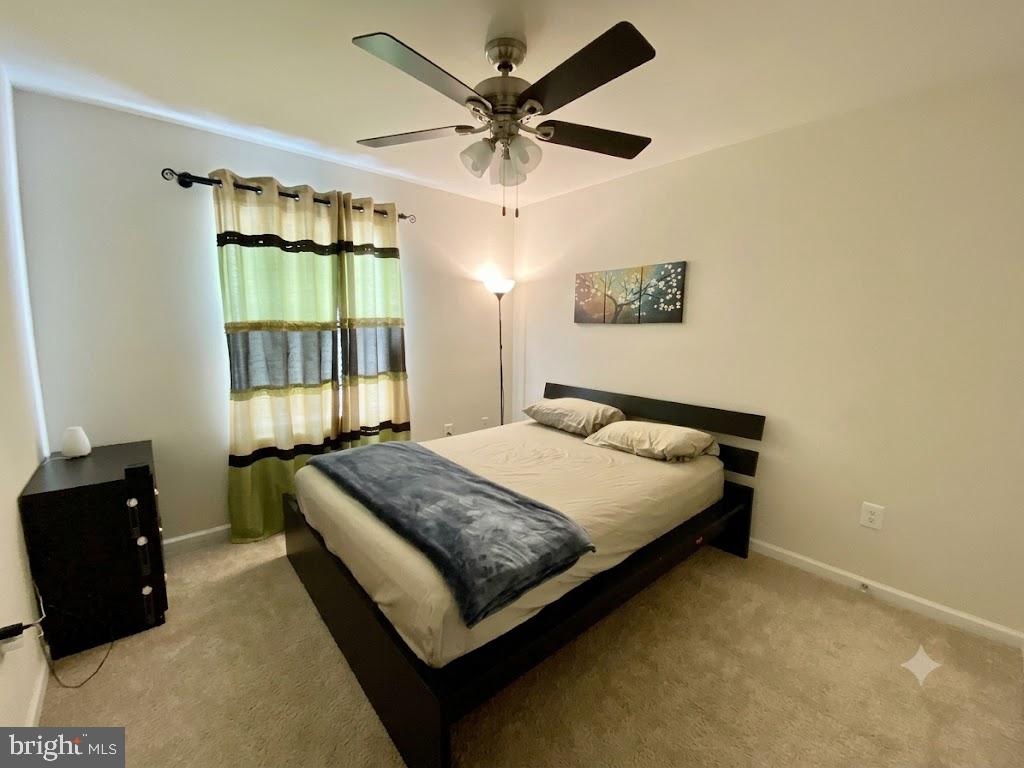 7014 Foxton Way Hanover, MD 21076 - Photo 8 of 29 Serene bedroom with soft lighting.