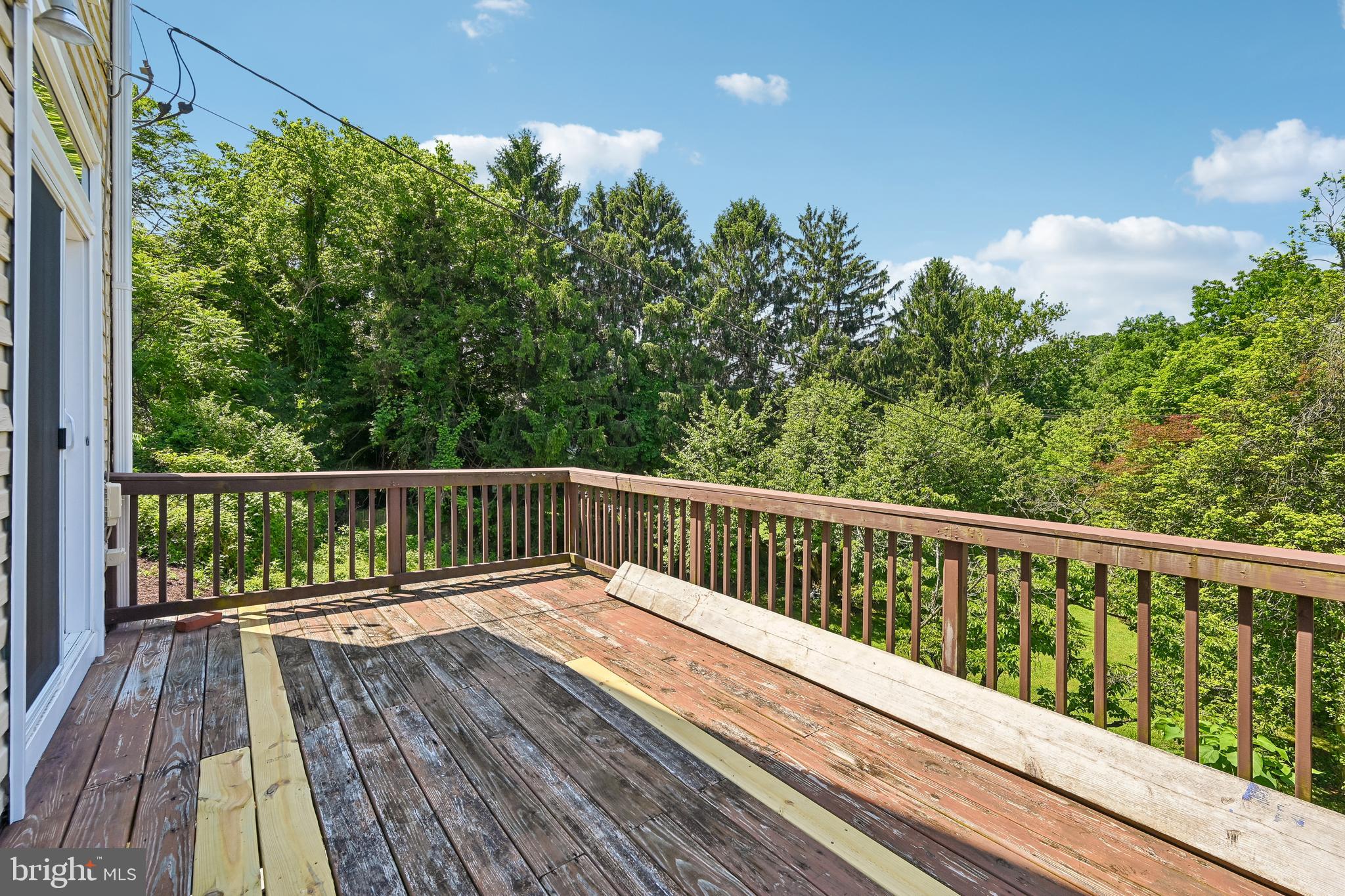 5702 Falls Road Baltimore, MD 21209 - Photo 35 of 49 a balcony with wooden floor and fence