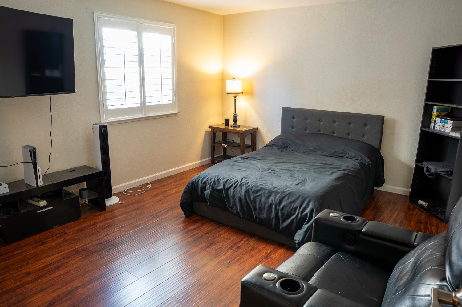 10961 Woolwich Way Mather, CA 95655 - Photo 12 of 28 a bedroom with a bed and a flat screen tv