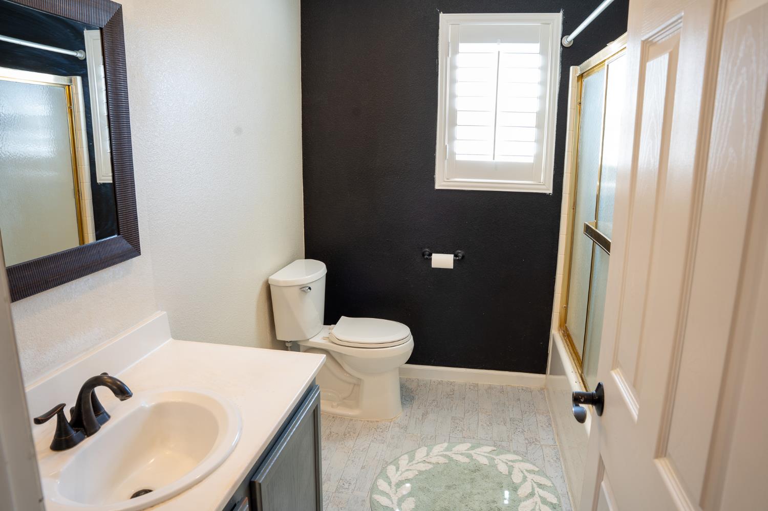 10961 Woolwich Way Mather, CA 95655 - Photo 15 of 28 a bathroom with a sink toilet and shower