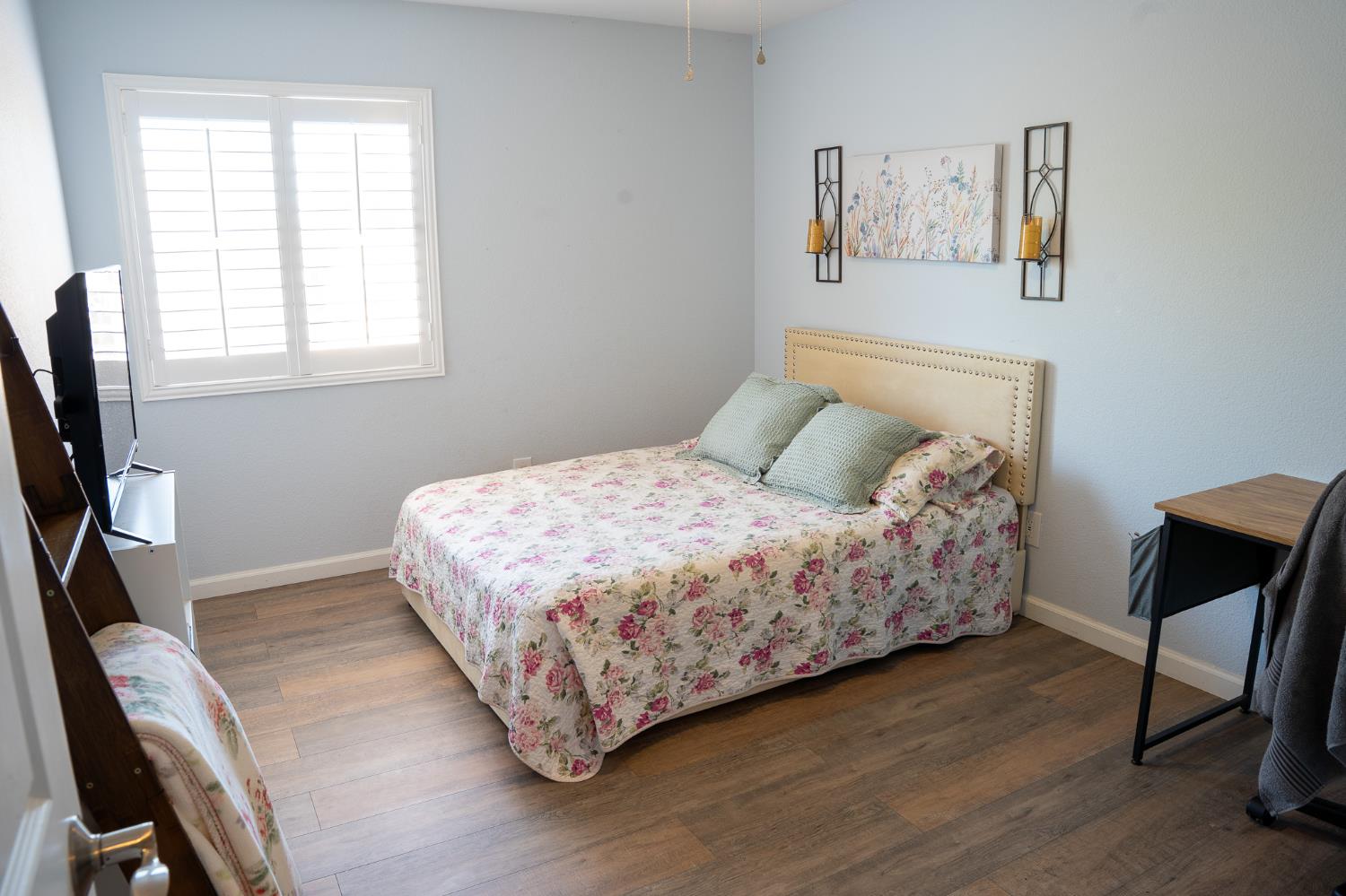 10961 Woolwich Way Mather, CA 95655 - Photo 18 of 28 a bedroom with a bed a window and a flat screen tv