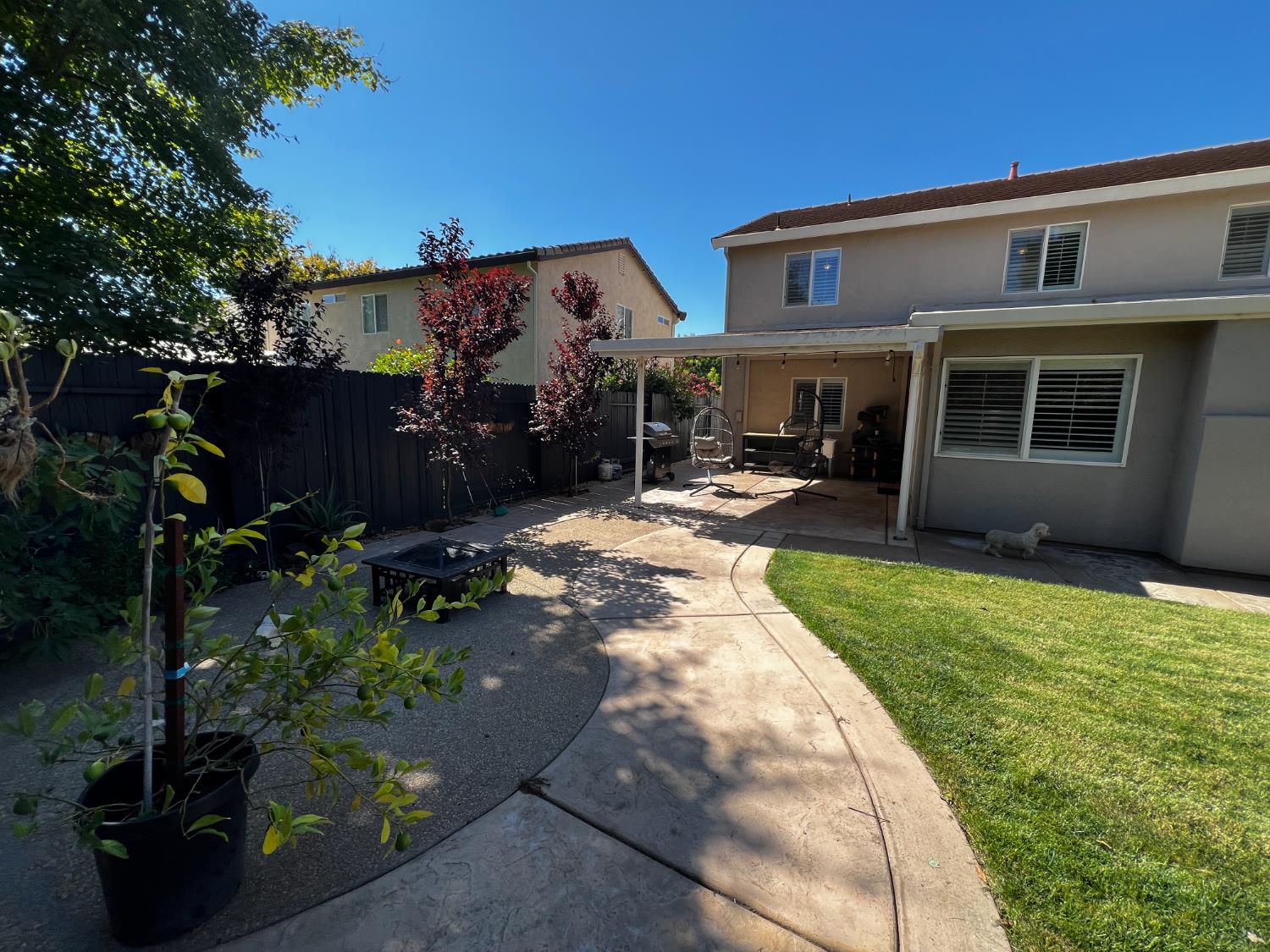 10961 Woolwich Way Mather, CA 95655 - Photo 27 of 28 a view of a house with many windows next to a yard