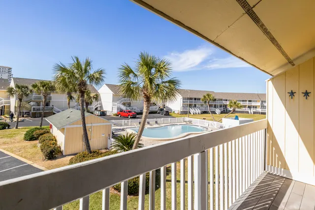 a view of a balcony with potted plants