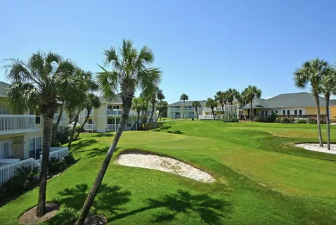 a view of a garden with a house