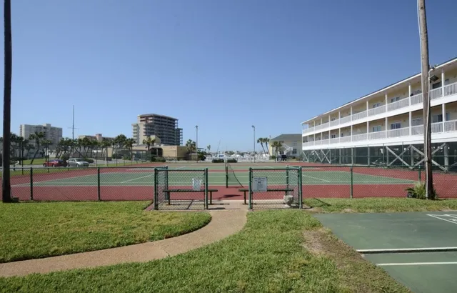 a view of a swimming pool with a yard