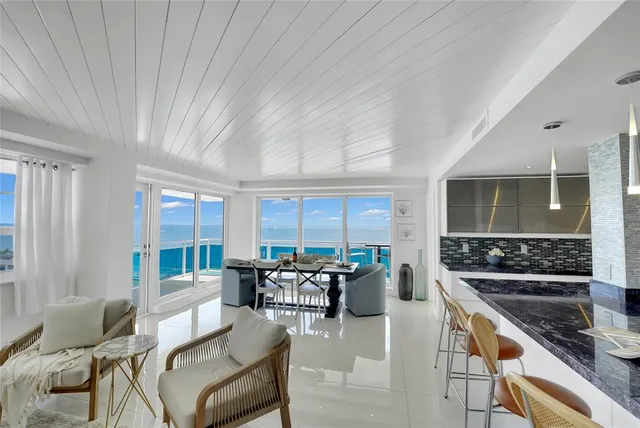 a dining room with furniture and a chandelier