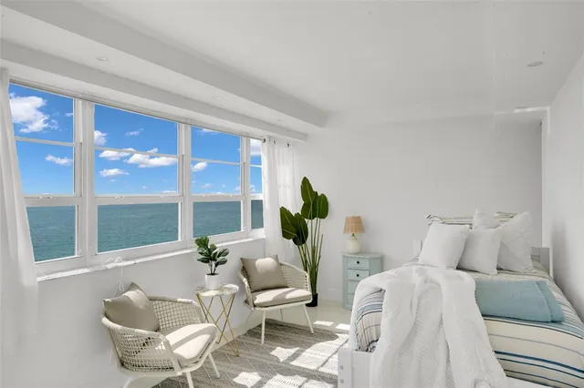 a bathroom with a sink a toilet a mirror and shower