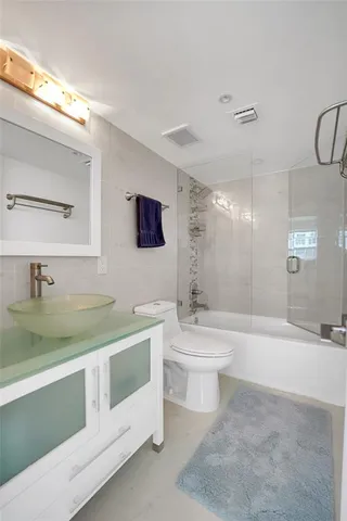 a bathroom with a sink and mirror