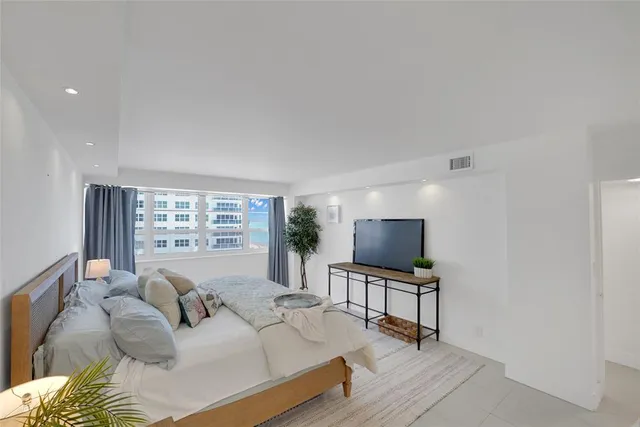 a view of a swimming pool with a table and chairs
