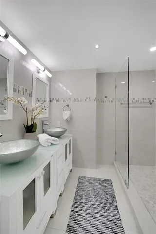 a living room with furniture wooden floor and a book shelf