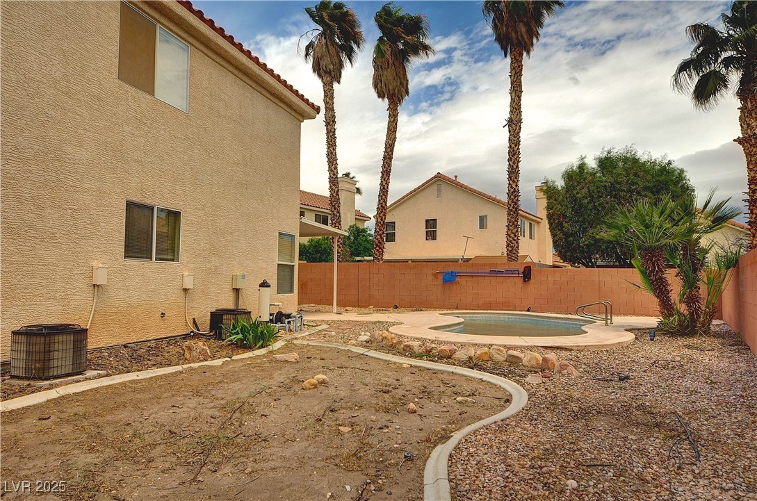 8332 Monico Valley Court Las Vegas, NV 89128 - Photo 13 of 14 Fenced backyard with a patio