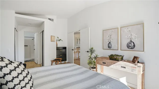 a bedroom with a bed and a couch