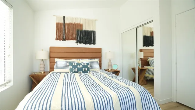 a bathroom with a toilet a sink and a mirror