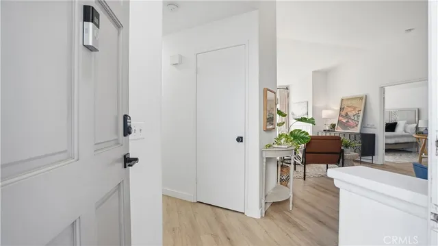 a view of a livingroom with furniture and a hardwood floor