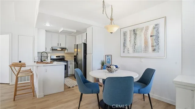 a view of kitchen with dining table and chairs