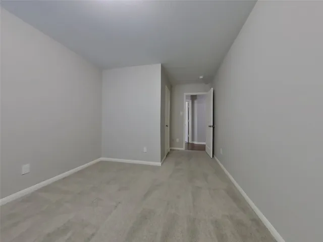 a room with a sink and a mirror