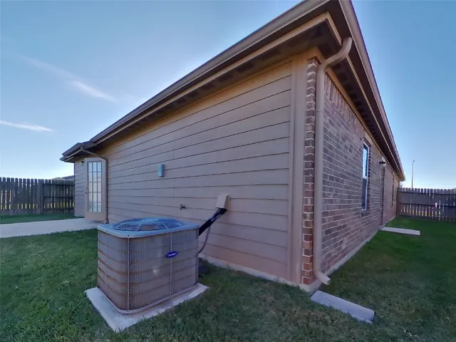 a view of a backyard with potted plants