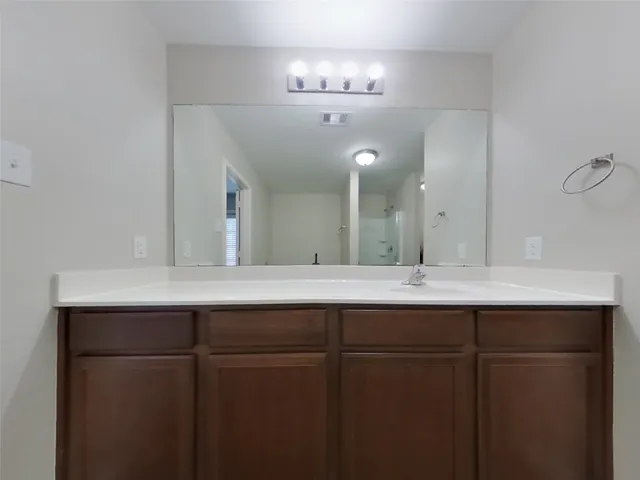 a white bath tub sitting next to a shower
