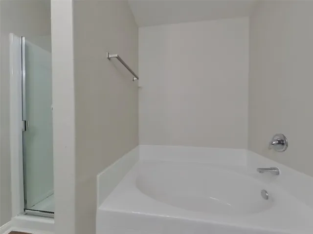 an empty room with windows and entrance