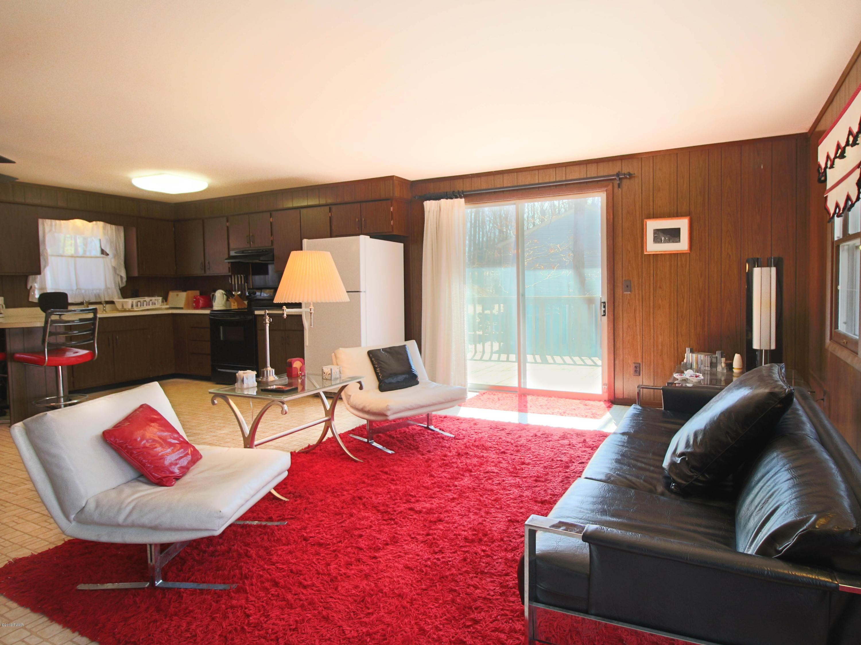 152 Butternut Road Milford, PA 18337 - Photo 7 of 27 a living room with furniture and a large window