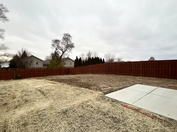 a street view with wooden fence