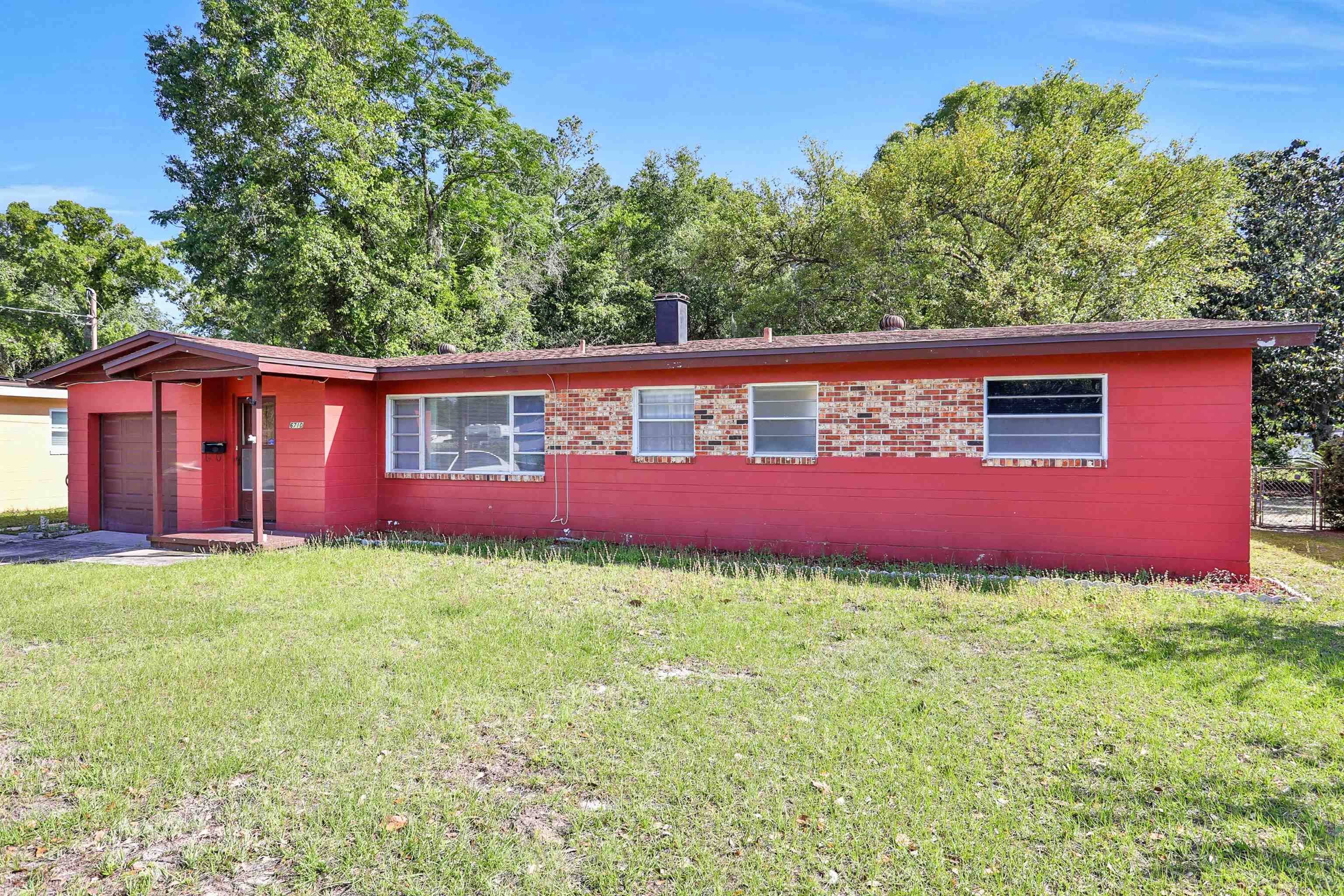 6710 Heidi Road Jacksonville, FL 32277 - Photo 1 of 23 a view of front of a house with a yard