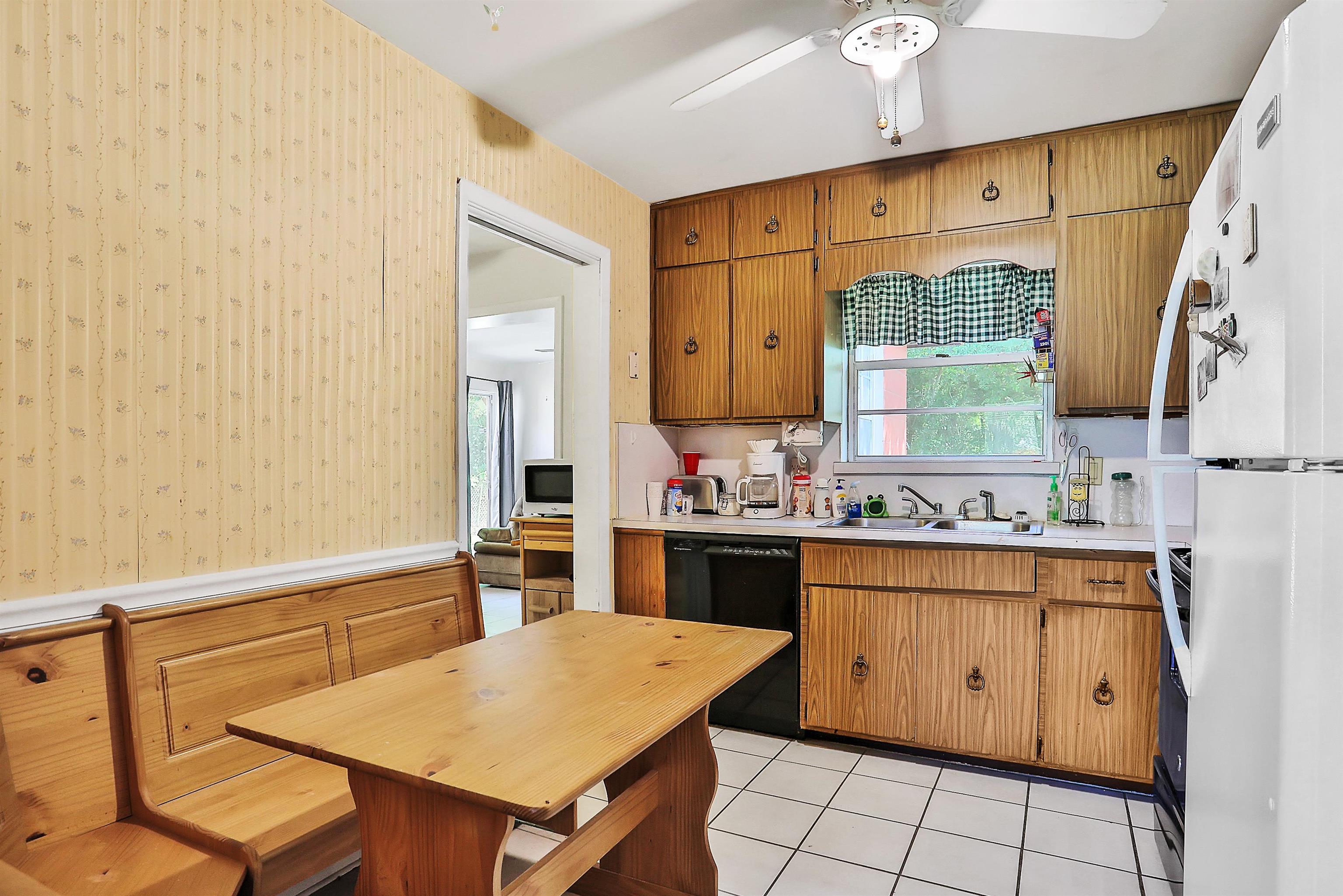 6710 Heidi Road Jacksonville, FL 32277 - Photo 11 of 23 a kitchen with a sink stove and cabinets