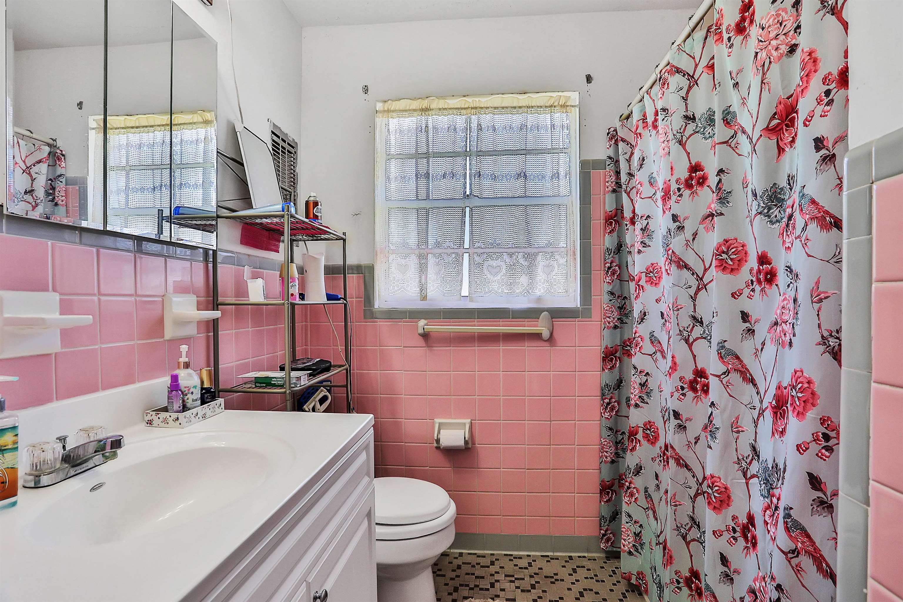 6710 Heidi Road Jacksonville, FL 32277 - Photo 13 of 23 a bathroom with a sink toilet and shower
