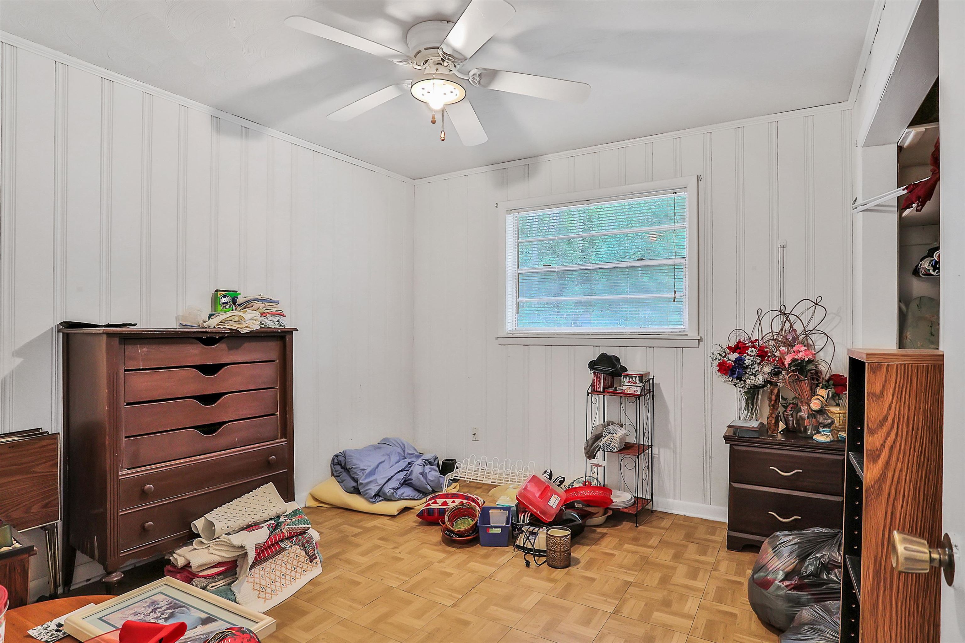 6710 Heidi Road Jacksonville, FL 32277 - Photo 14 of 23 a bedroom with a bed and cabinets