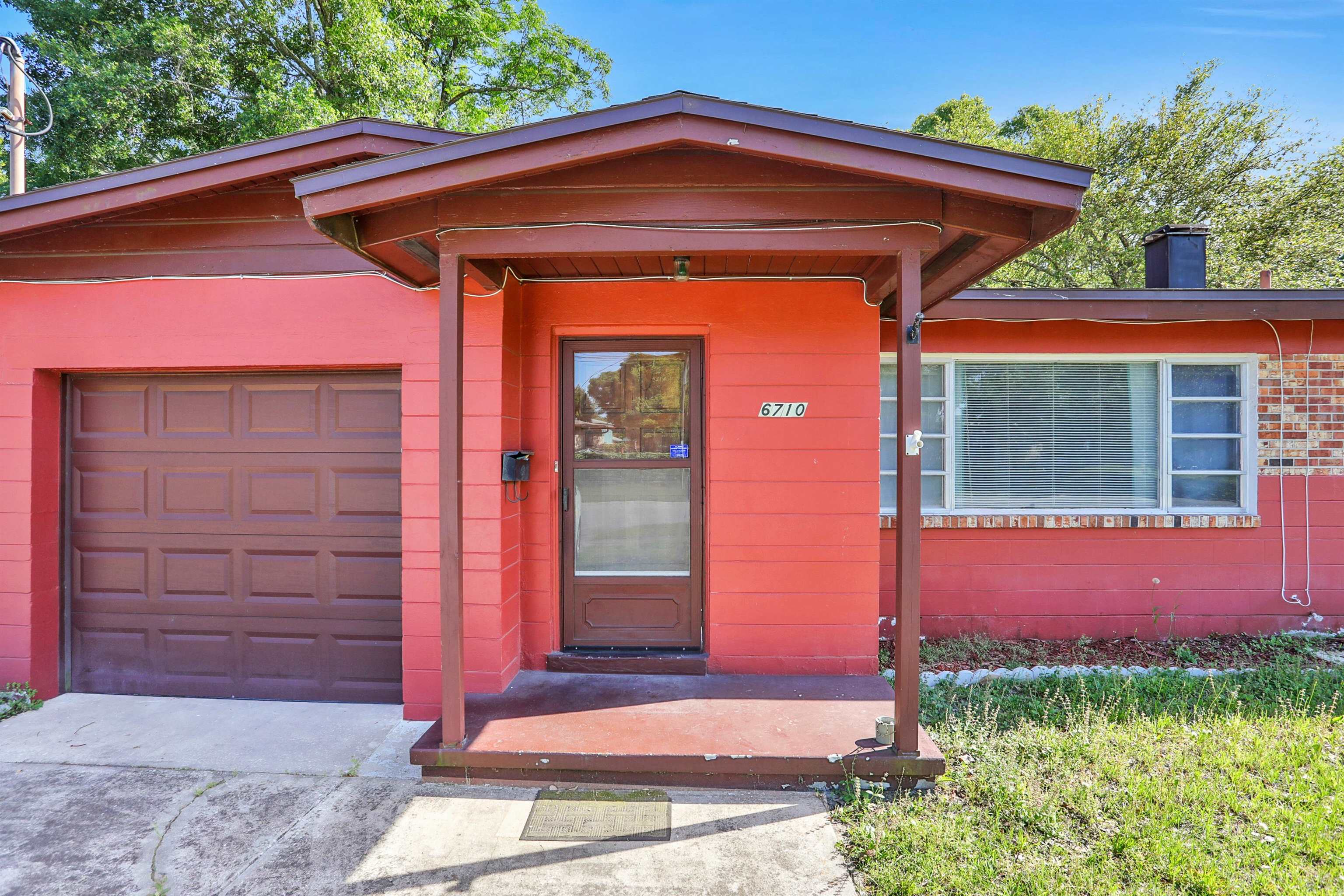 6710 Heidi Road Jacksonville, FL 32277 - Photo 2 of 23 a front view of a house with garden