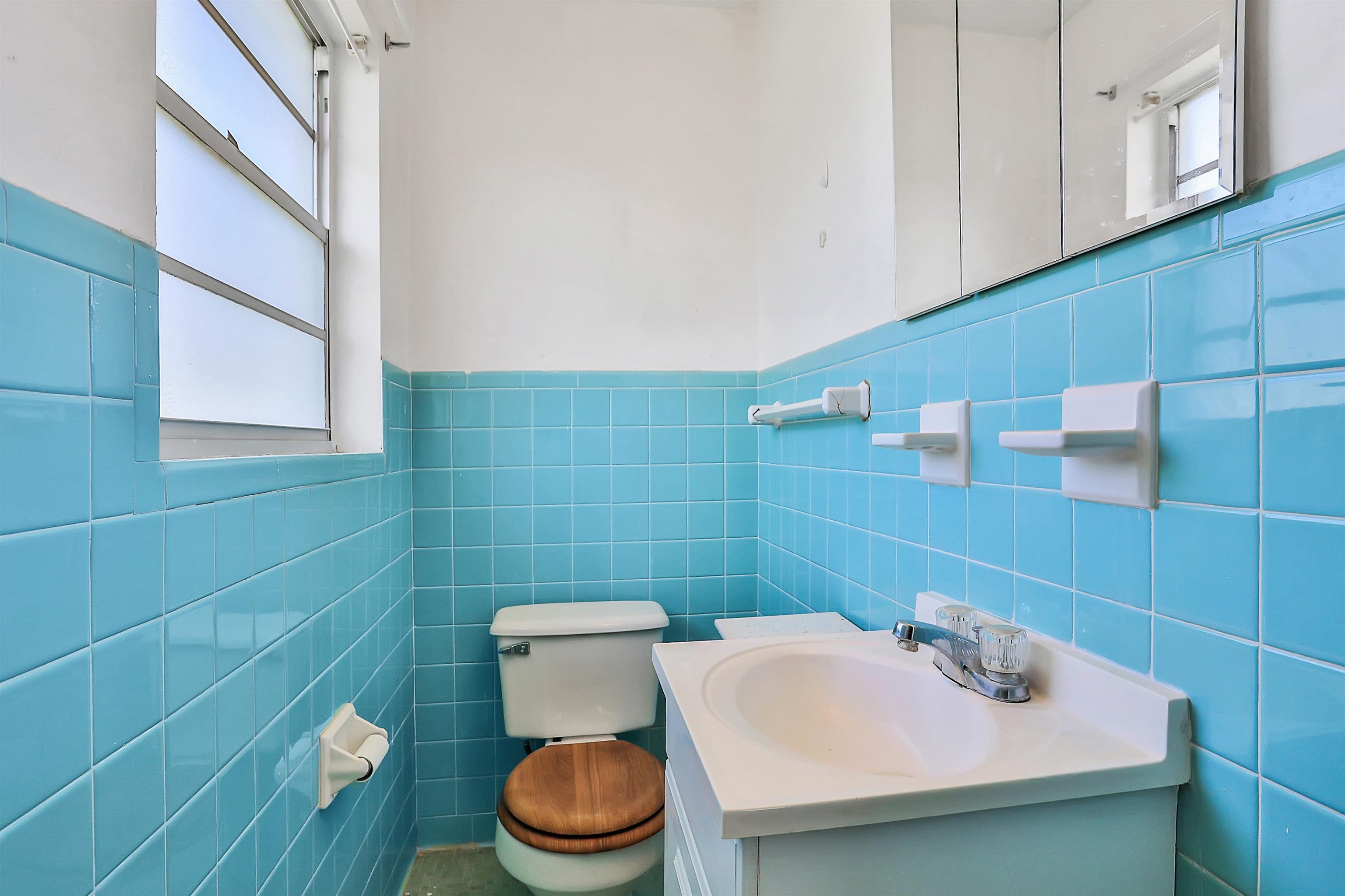 6710 Heidi Road Jacksonville, FL 32277 - Photo 21 of 23 a bathroom with a sink and a toilet