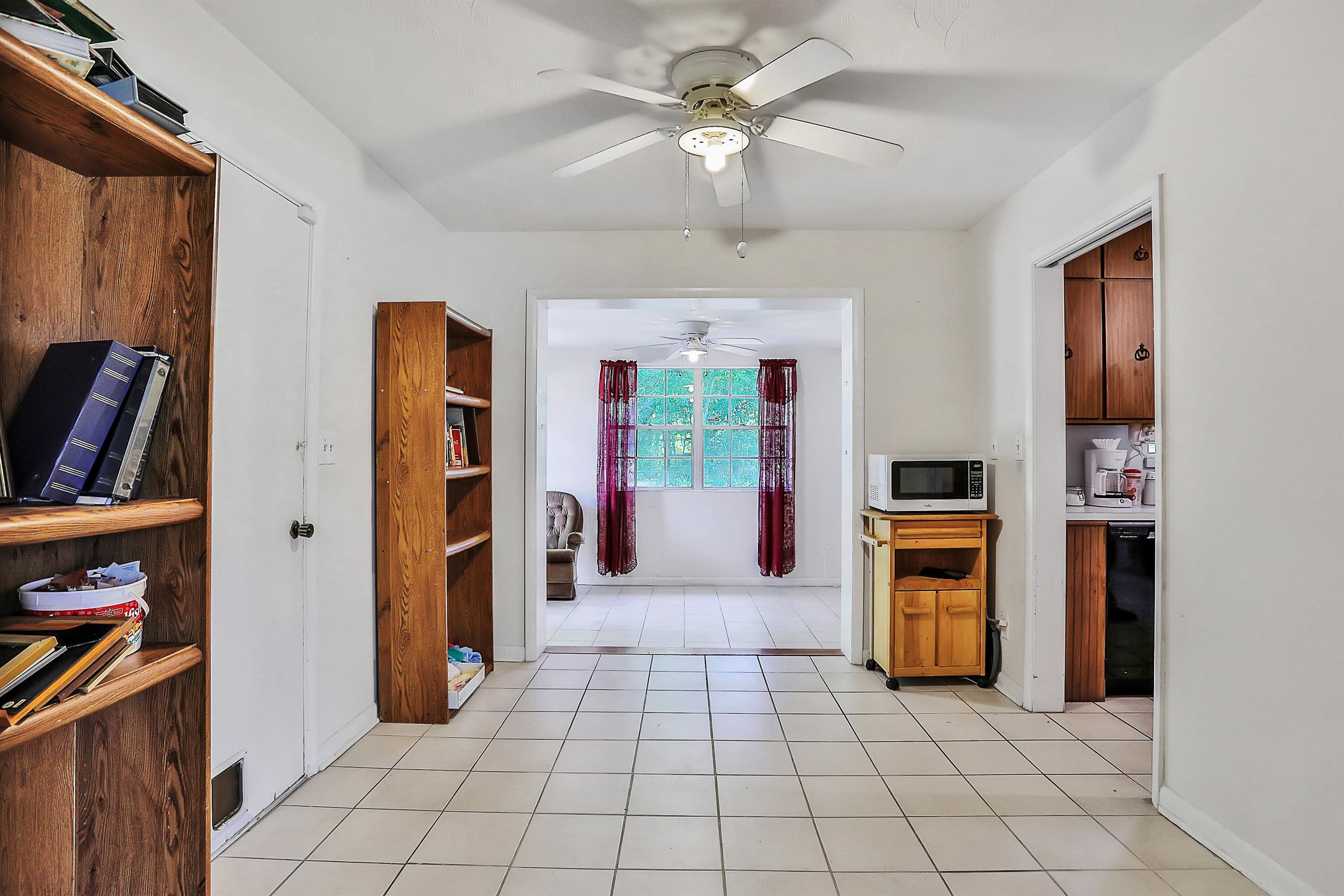 6710 Heidi Road Jacksonville, FL 32277 - Photo 6 of 23 a view of a entryway with furniture and a ceiling fan