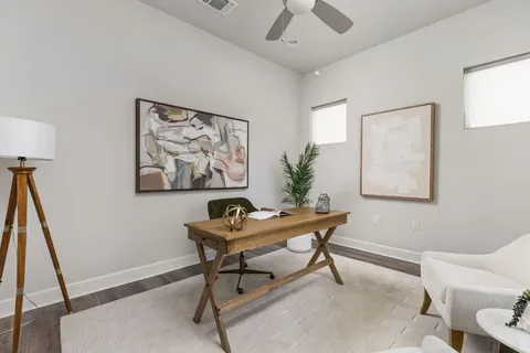 a workspace with furniture and window