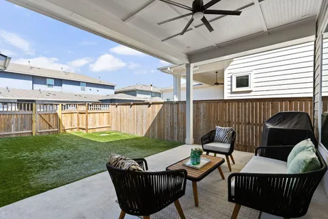 a outdoor space with patio the couch and a window