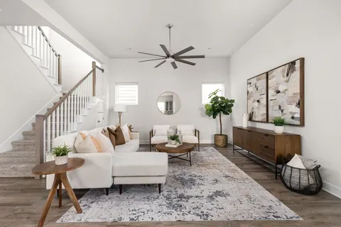 a living room with furniture and a rug