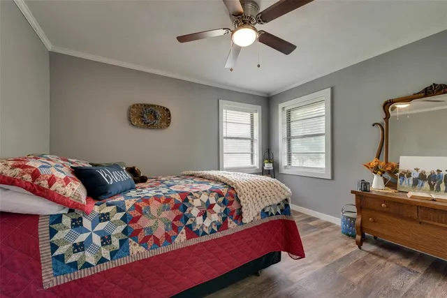 a bedroom with bed and window