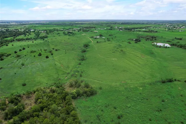 a view of a field with an outdoor space
